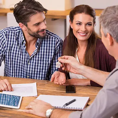 Image of couple receiving house keys